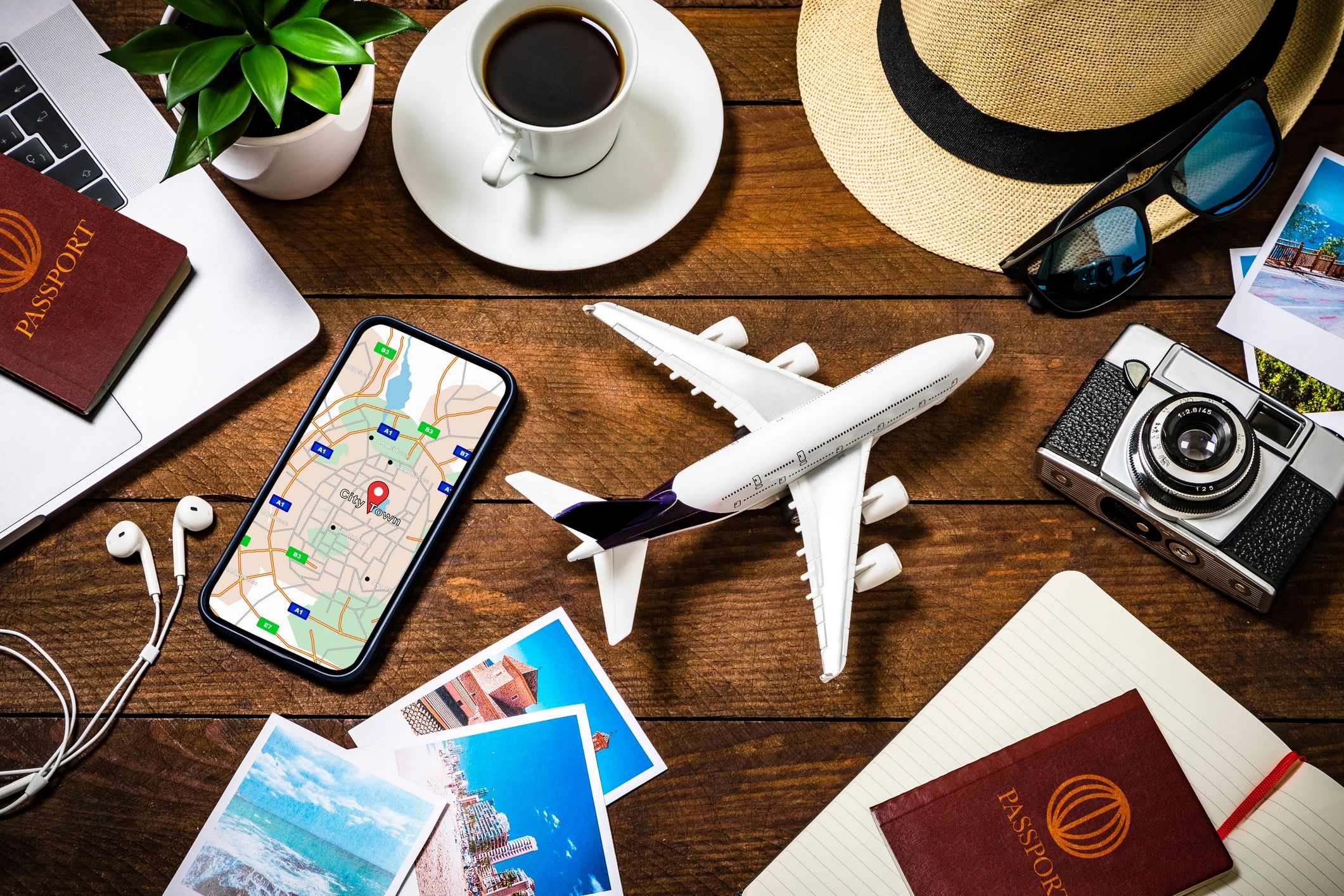 Travel planning desk with map, notebook, and camera